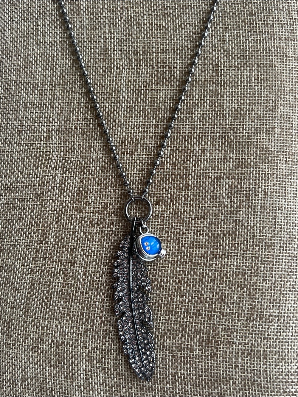 Silver-Tone Feather Pendant Necklace with Blue Accent Charm